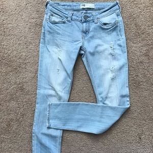 Light-washed ripped skinny jeans